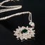 Necklace with Sun Design Adorned with Synthetic Emerald