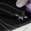 Verstelbare zilveren ketting met blauwe synthetische saffier